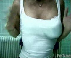 Woman looking at her self in the mirror and feeling sexy.  Then she eats a crunchy candy and there is a loud popping noise.  She looks at herself and sees that one of her silicone breasts has deflated.