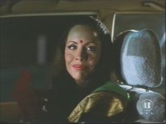Tane McClure removing her indian princess disguise in "Inferno" (1997)