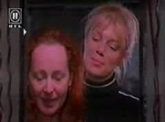 Part from the series La Femme Nikita. Nikita has some wig fun with an old friend.