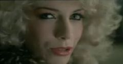 Eurythmics musical video clip Love is a stranger. Annie Lennox taking off curly blonde wig.